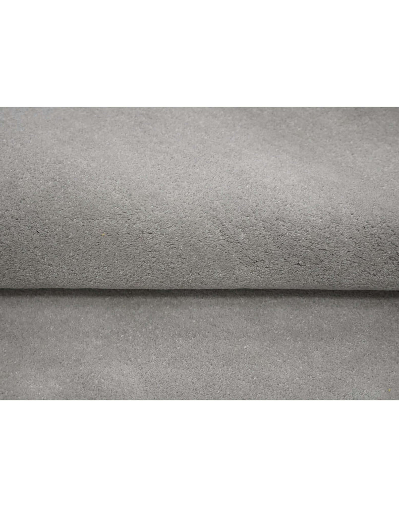 I C O N - S I L V E R luxury handmade rug by Cherom, made from New Zealand wool in a sleek gray finish.