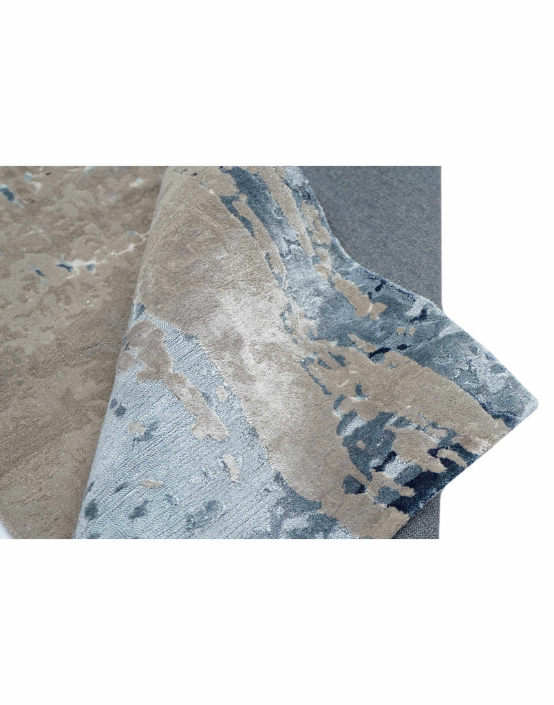 M A N Z O N I luxury handmade rug by Cherom in grey and blue New Zealand wool.