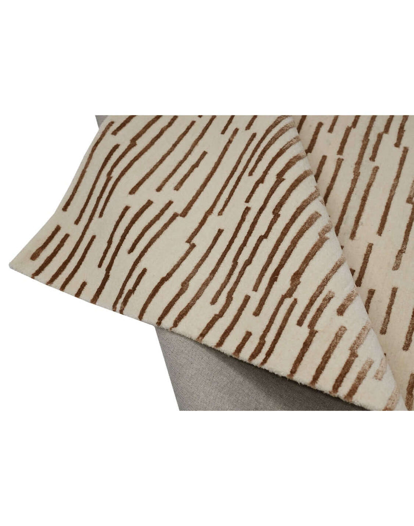 D A S H luxury modern rug by Cherom, featuring a dynamic design with horizontal lines in warm browns on beige.