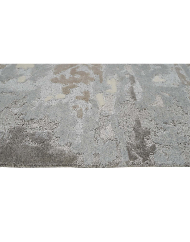 F R O S T luxury modern rug by Cherom, a contemporary rug featuring a mix of charcoal, silver-grey, warm taupe, and soft ivory.