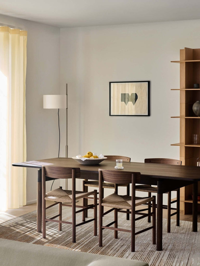 H O R I Z O N luxury modern rug by Cherom in a contemporary dining space with stylish furniture.