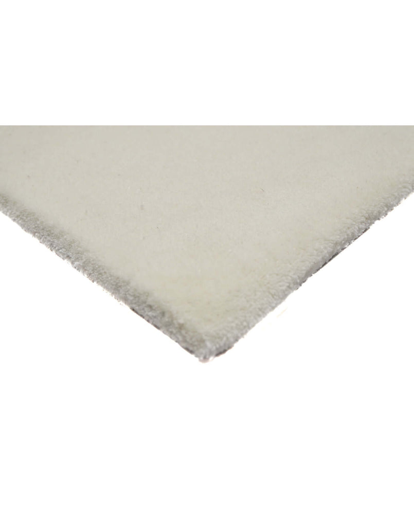 I C O N - M I L K rug corner detail, showcasing hand-tufted New Zealand wool craftsmanship.