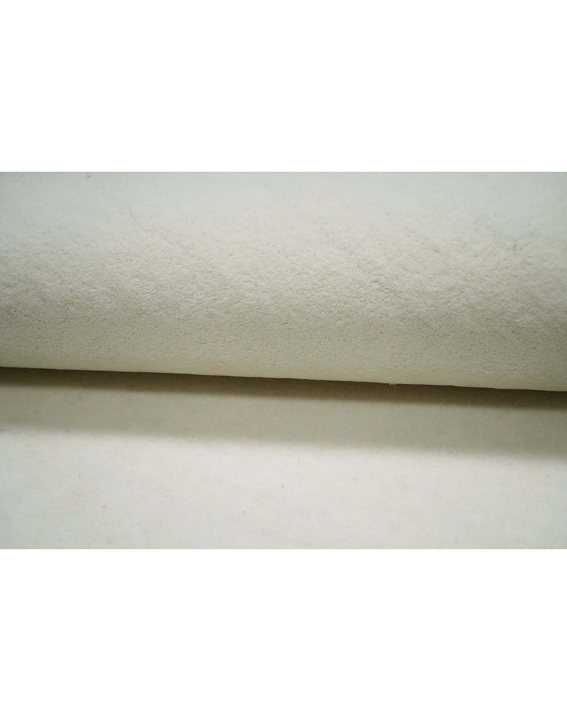 I C O N - M I L K rug made of 100% New Zealand wool, showcasing its soft texture and high-quality craftsmanship.