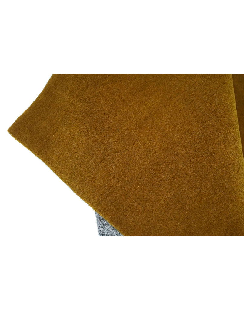 I C O N - O C H R E rug detail showcasing rich ochre color and fine New Zealand wool craftsmanship.