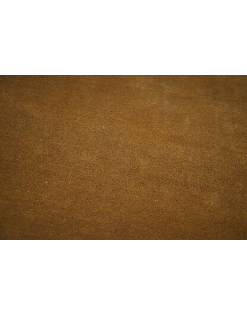 I C O N - O C H R E rug made from premium New Zealand wool in a rich ochre hue, showcasing high density tufted craftsmanship.