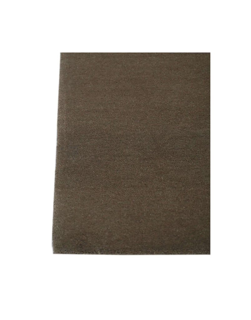 I C O N - T R U F F L E rug in a classic brown color, made from 100% New Zealand wool, showcasing dense tufting.