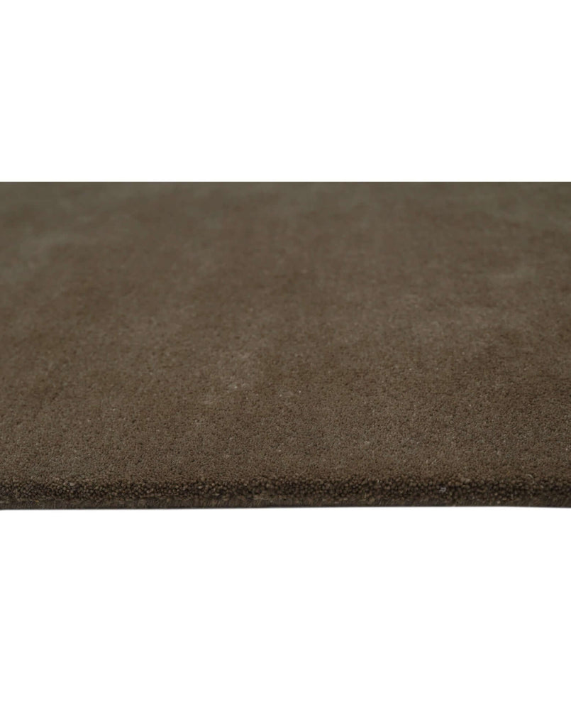 Close-up of the I C O N - T R U F F L E rug showcasing its rich texture and high-quality New Zealand wool craftsmanship.