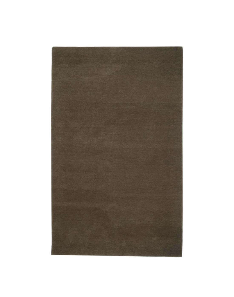 I C O N - T R U F F L E rug in a rich brown color, handcrafted from 100% New Zealand wool with dense tufting.
