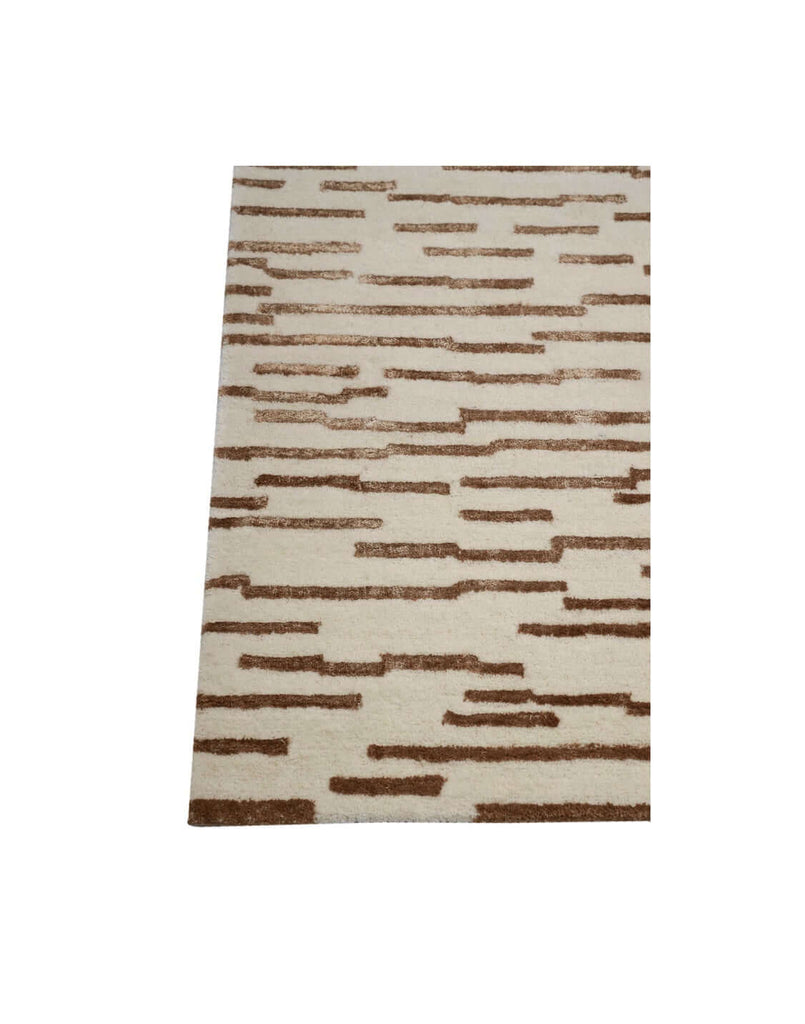 D A S H luxury modern rug by Cherom - a contemporary rug with warm brown accents on a beige background.