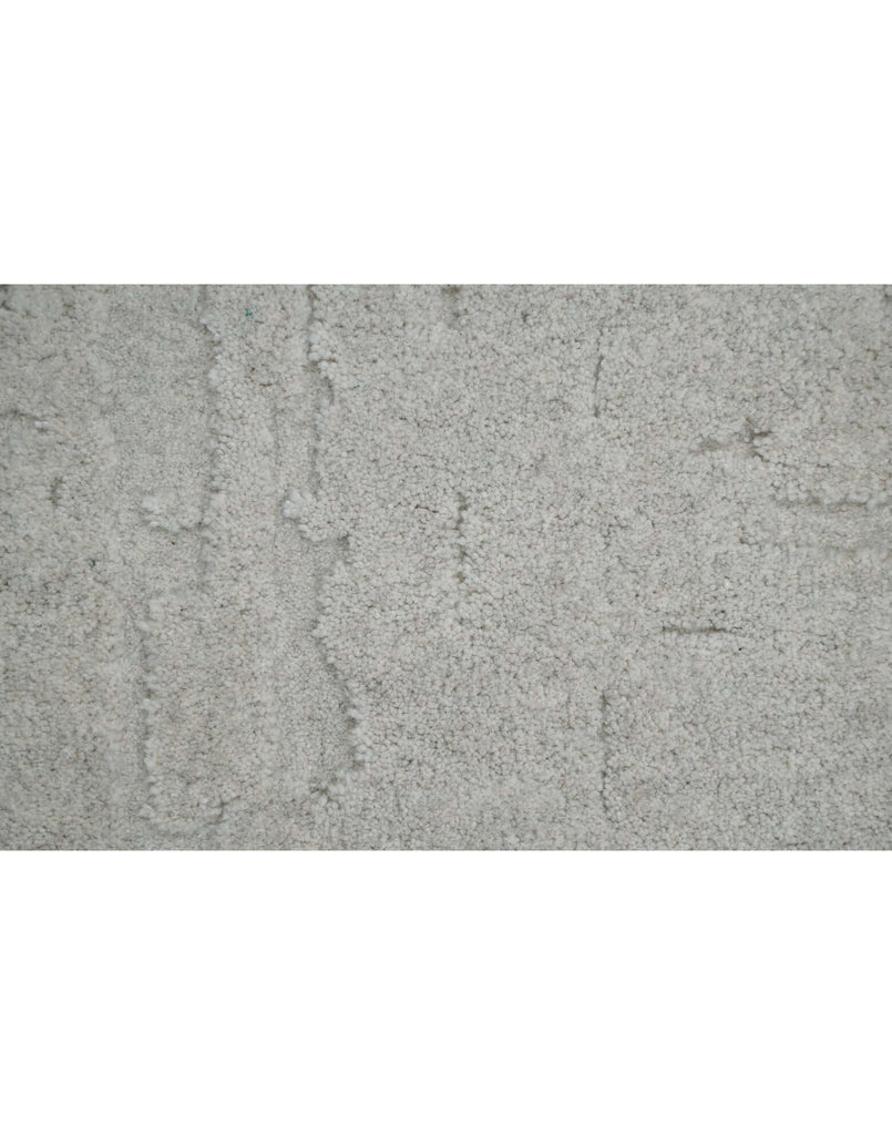 S C U L P T E D - U R B A N A luxury modern rug by Cherom featuring a soft grey tone and textured design.