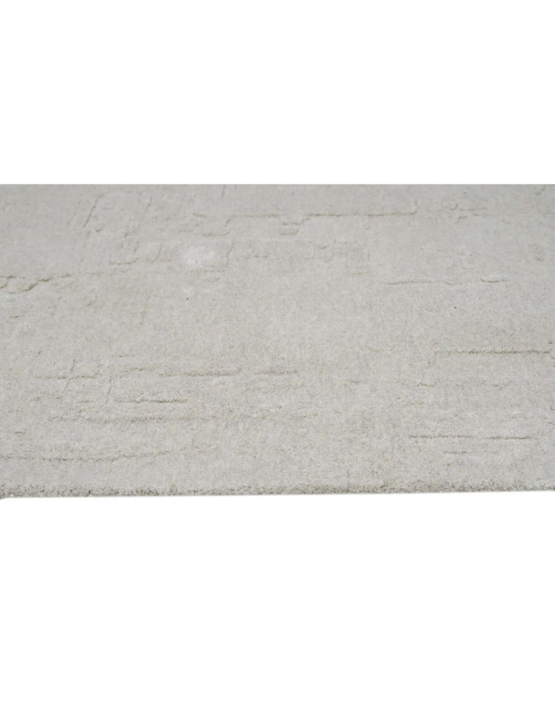 S C U L P T E D - U R B A N A luxury modern rug by Cherom - soft grey tone with carved texture.