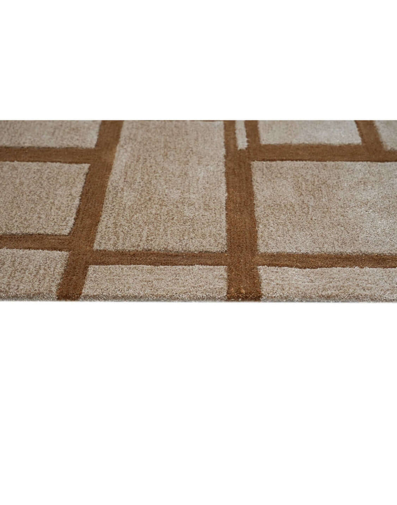S T O N E W O R K luxury modern rug by Cherom - a contemporary luxury rug with a grid pattern in rust and beige.