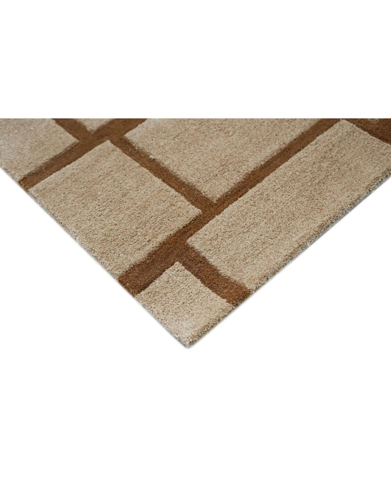 S T O N E W O R K luxury modern rug by Cherom, featuring a structured grid design in rust and beige.