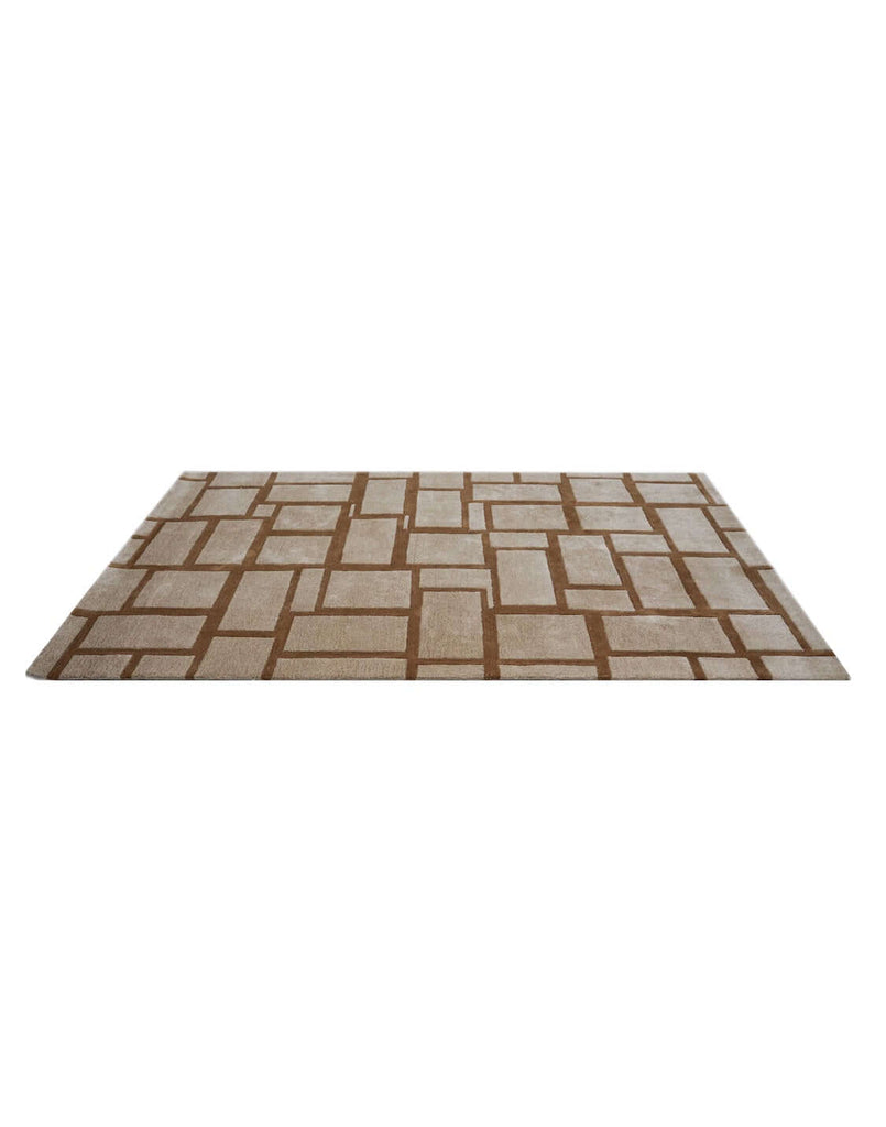 S T O N E W O R K luxury modern rug by Cherom, featuring a structured grid pattern in rust on beige.
