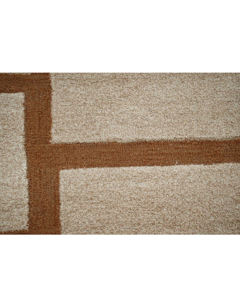 S T O N E W O R K luxury modern rug by Cherom, featuring a neutral beige background and rust-toned geometric pattern.